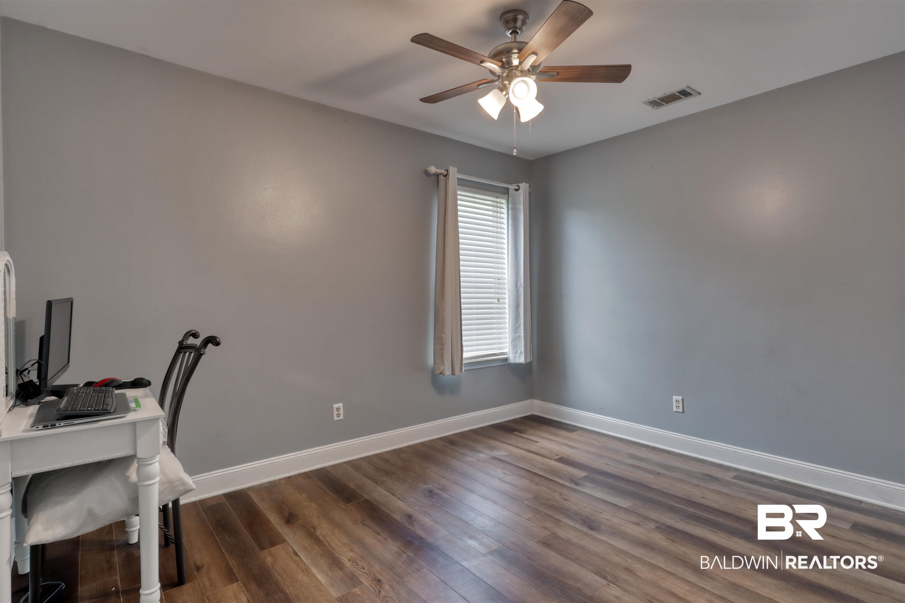 3200 Loop Road, Unit 61 Orange Beach, AL 36561 - Photo 13 of 32 Unfurnished office with ceiling fan and dark wood-type flooring