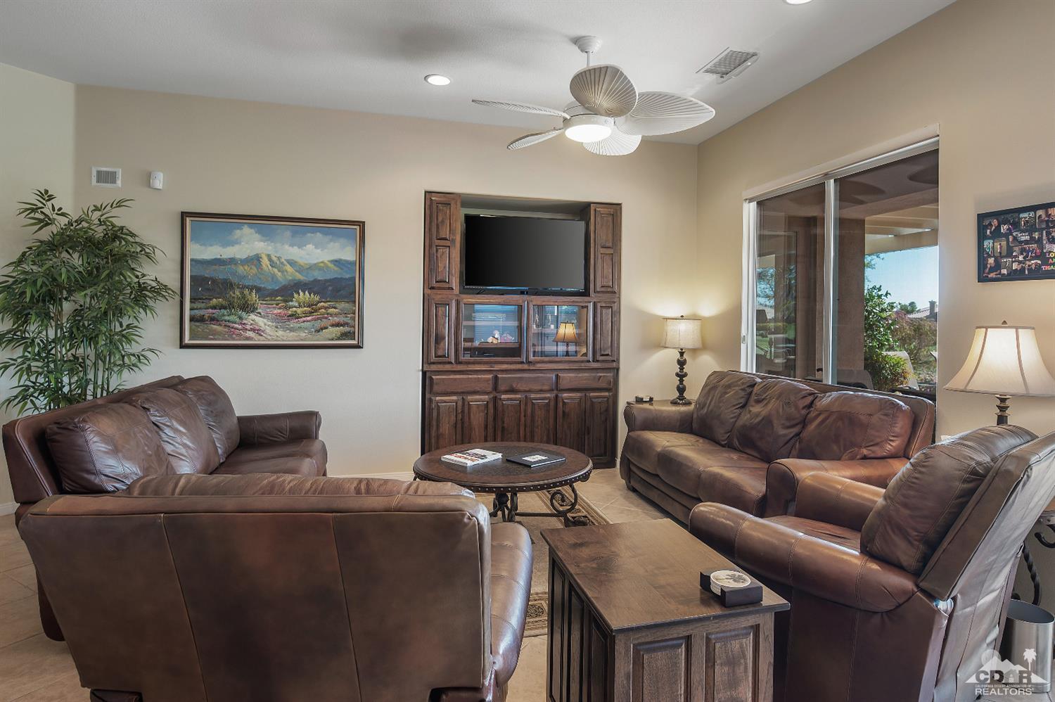 80557 Knightswood Road Indio, CA 92201 - Photo 12 of 30 a living room with furniture and a flat screen tv