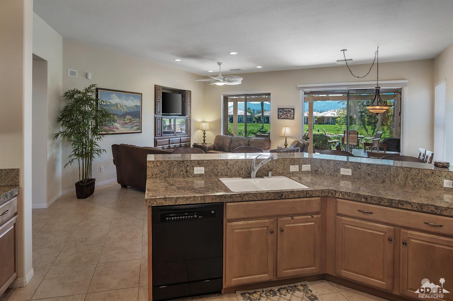 80557 Knightswood Road Indio, CA 92201 - Photo 16 of 30 a kitchen with a sink and a stove