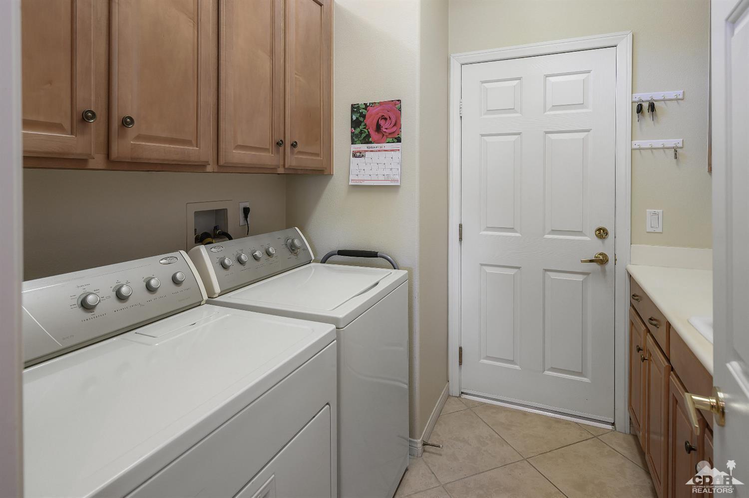 80557 Knightswood Road Indio, CA 92201 - Photo 17 of 30 a utility room with dryer and washer