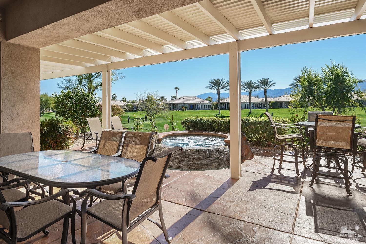 80557 Knightswood Road Indio, CA 92201 - Photo 18 of 30 a view of an outdoor dining space with a table and chairs