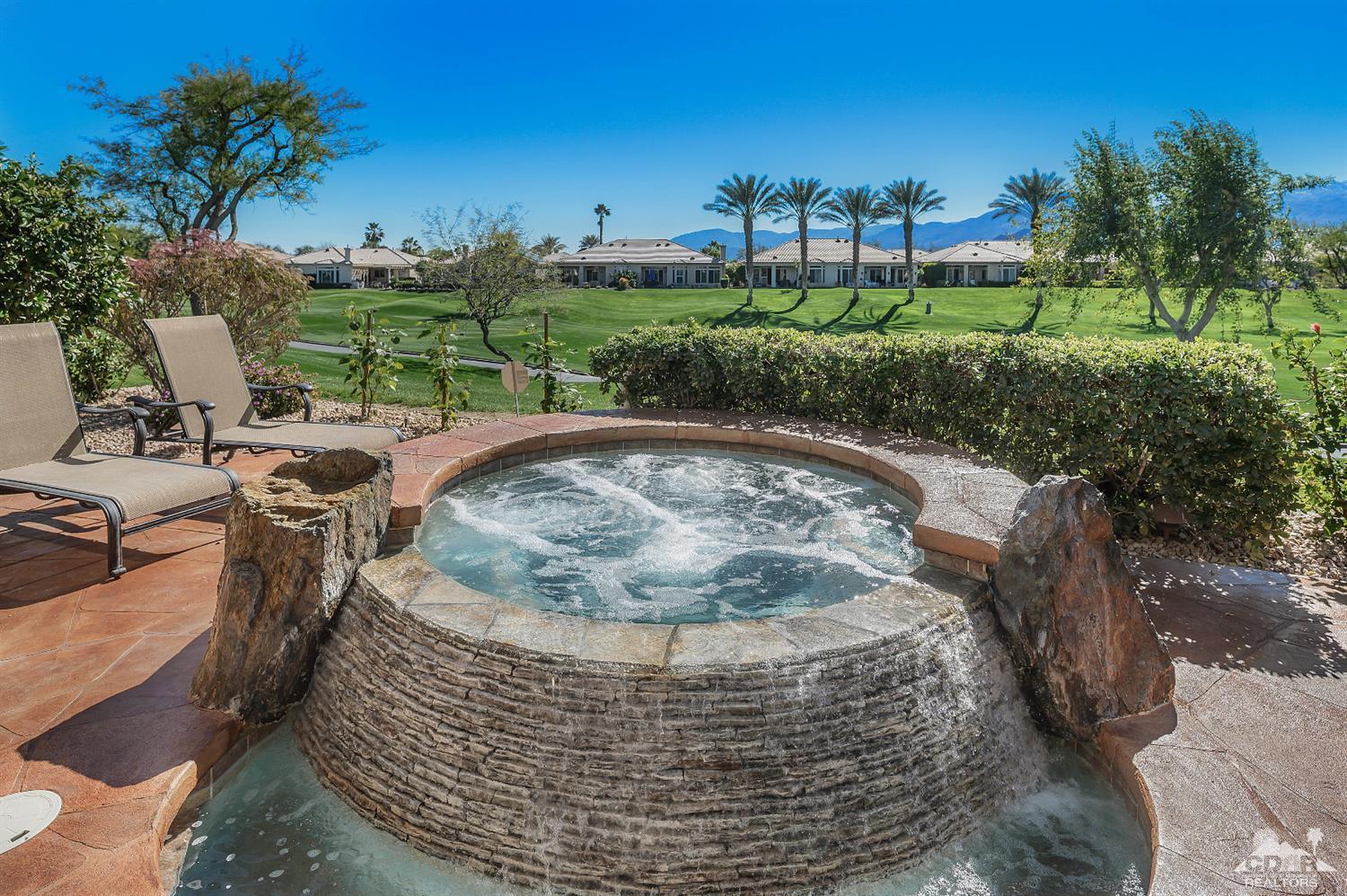 80557 Knightswood Road Indio, CA 92201 - Photo 21 of 30 a view of a swimming pool with a yard