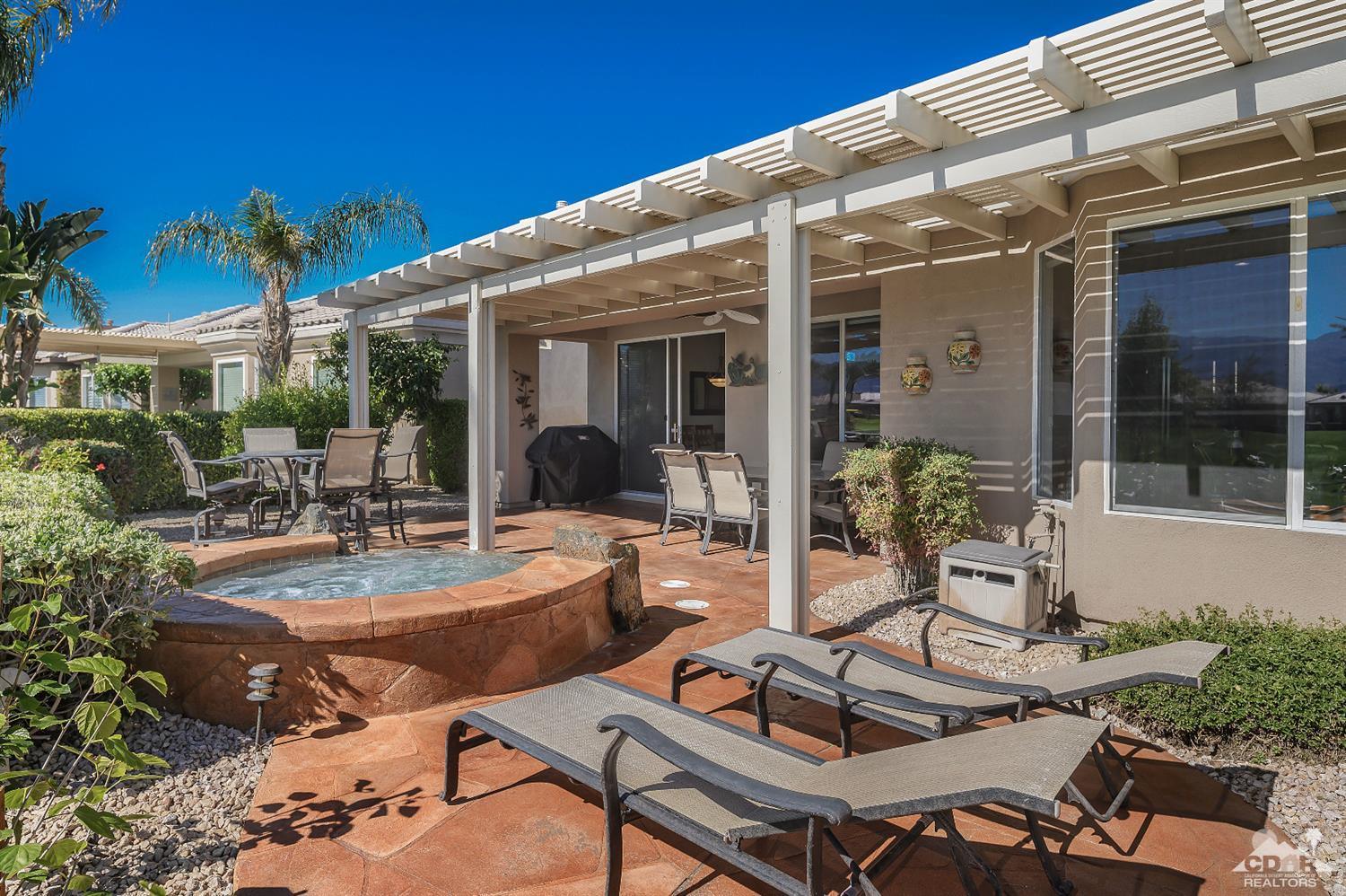 80557 Knightswood Road Indio, CA 92201 - Photo 23 of 30 a view of a backyard with sitting area
