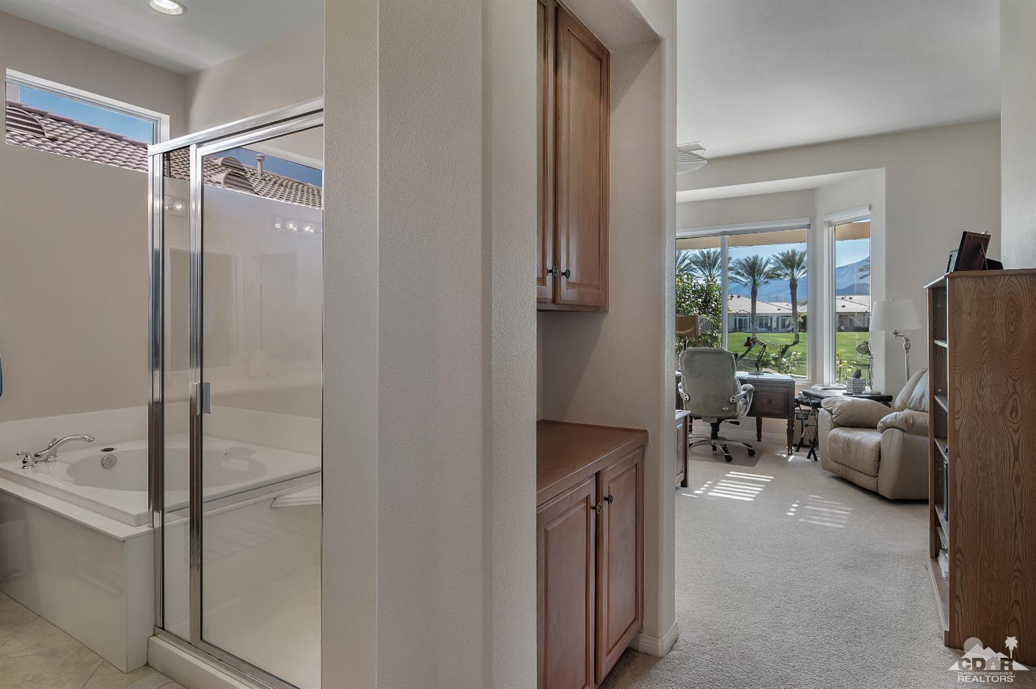 80557 Knightswood Road Indio, CA 92201 - Photo 24 of 30 a bedroom with a bed and a couch