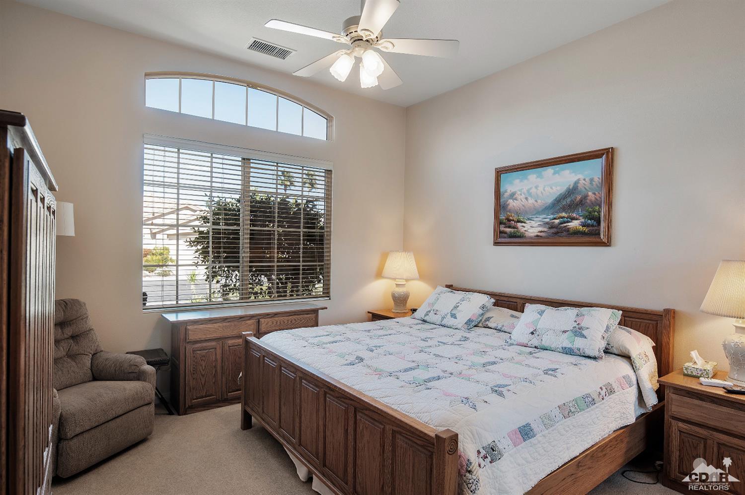 80557 Knightswood Road Indio, CA 92201 - Photo 28 of 30 a bedroom with a bed and a couch