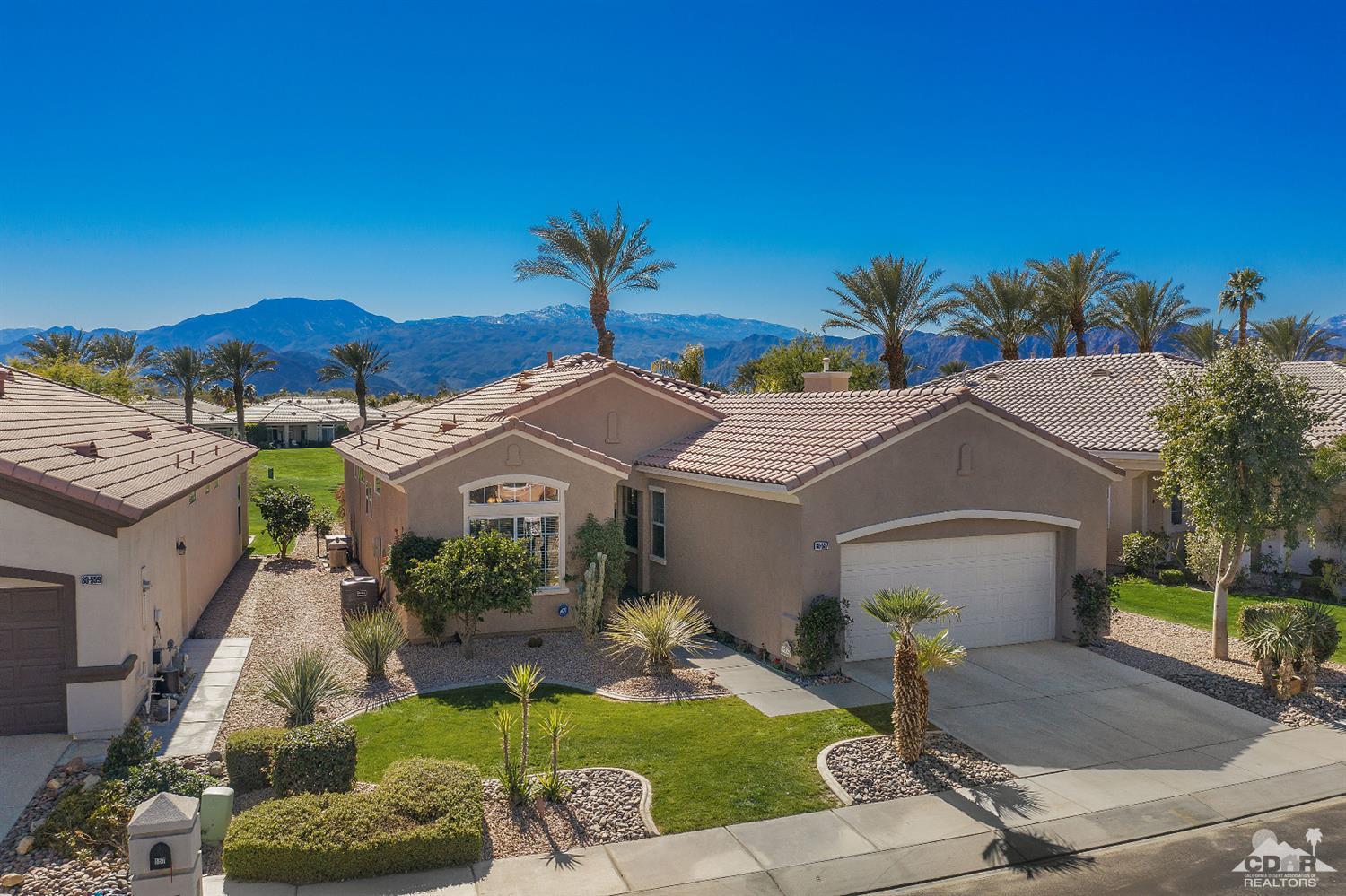 80557 Knightswood Road Indio, CA 92201 - Photo 6 of 30 a front view of a house with a garden