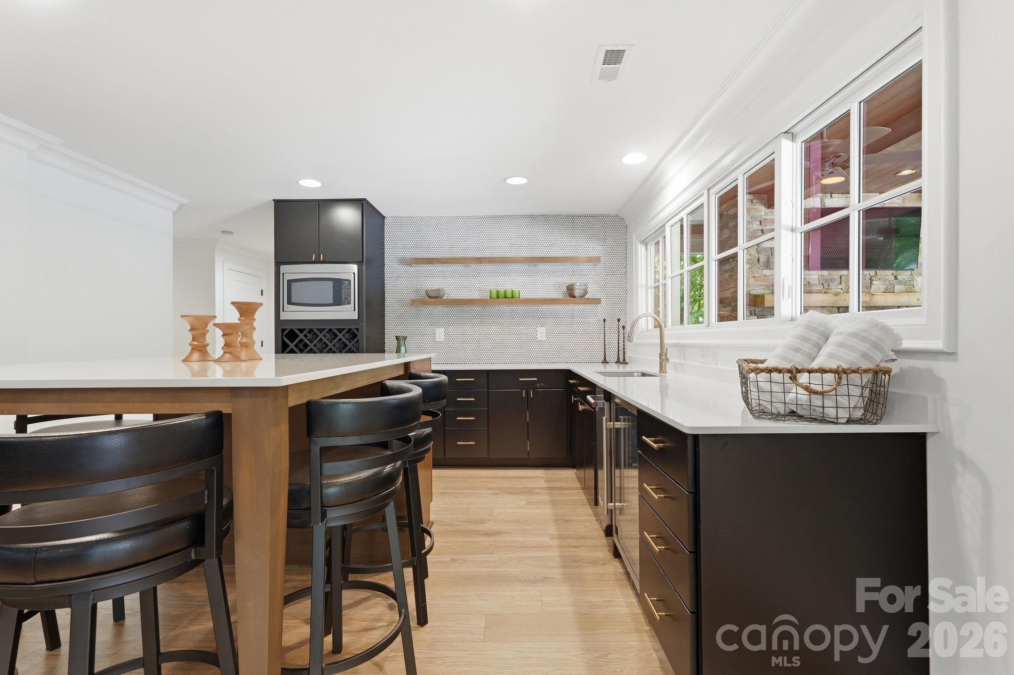 235 Grey Road Davidson, NC 28036 - Photo 28 of 42 a kitchen with granite countertop a stove and a sink