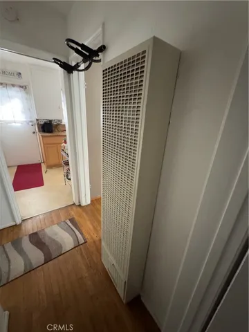 a view of hallway with furniture and a rug