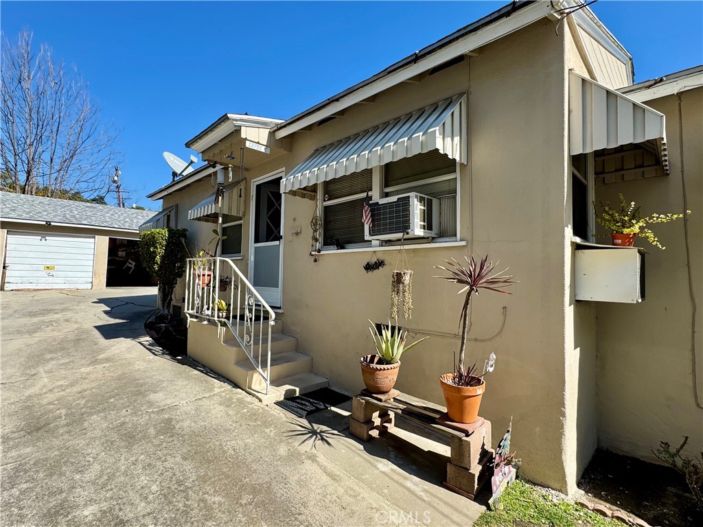 13751 Penn Street Whittier, CA 90602 - Photo 7 of 17 a view of a house with wooden floor and a flat screen tv