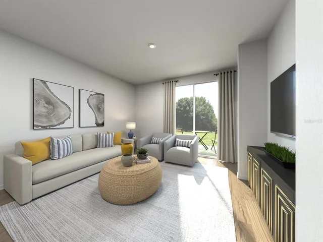 a living room with furniture and a flat screen tv