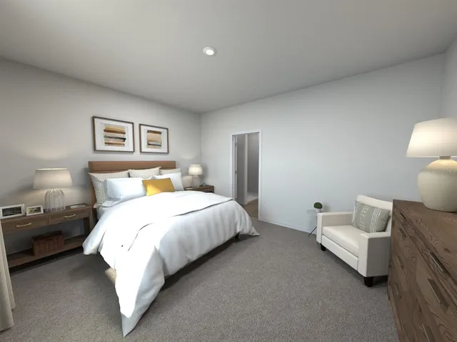 a bedroom with a bed and a couch