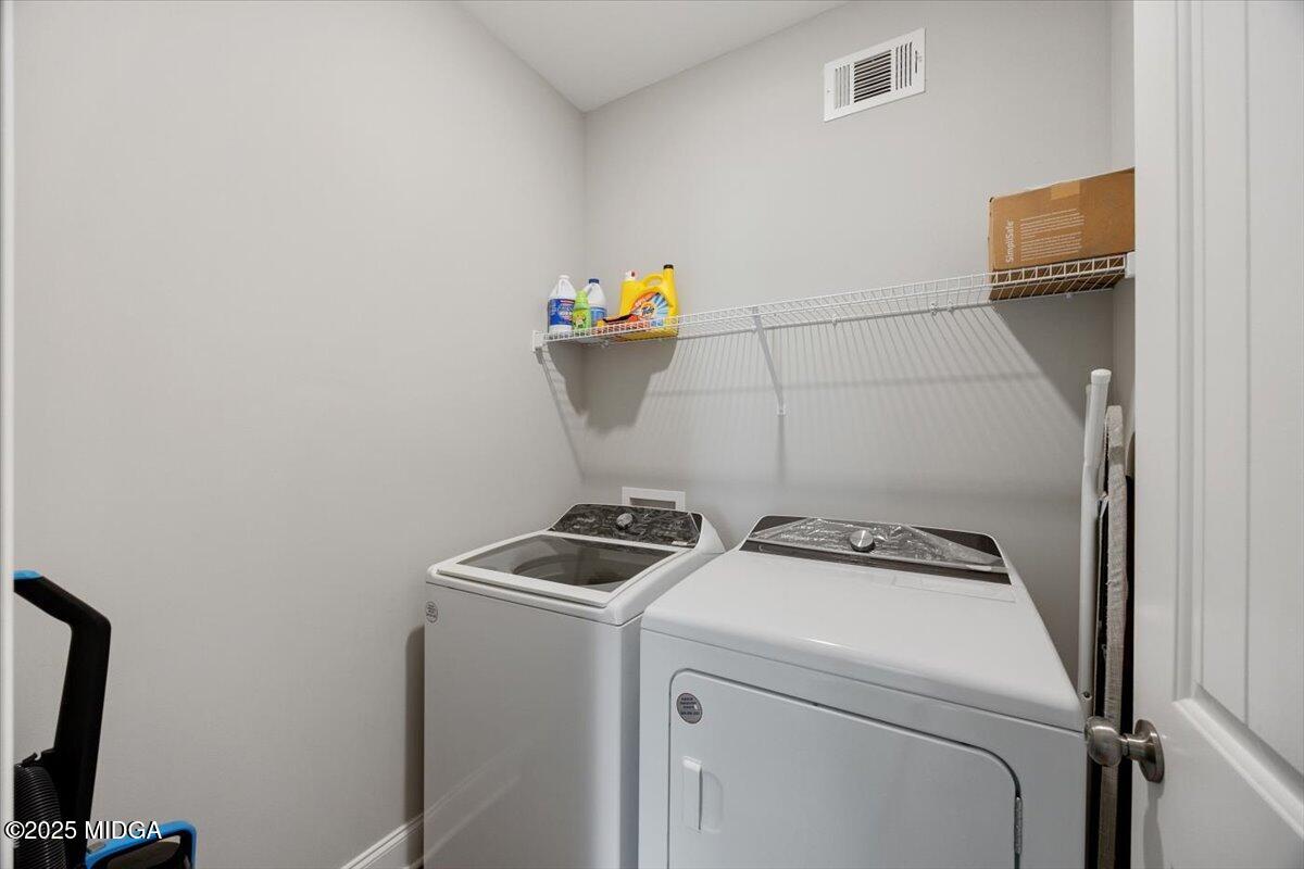 309 Davis Road Gray, GA 31032 - Photo 12 of 48 a utility room with dryer and washer