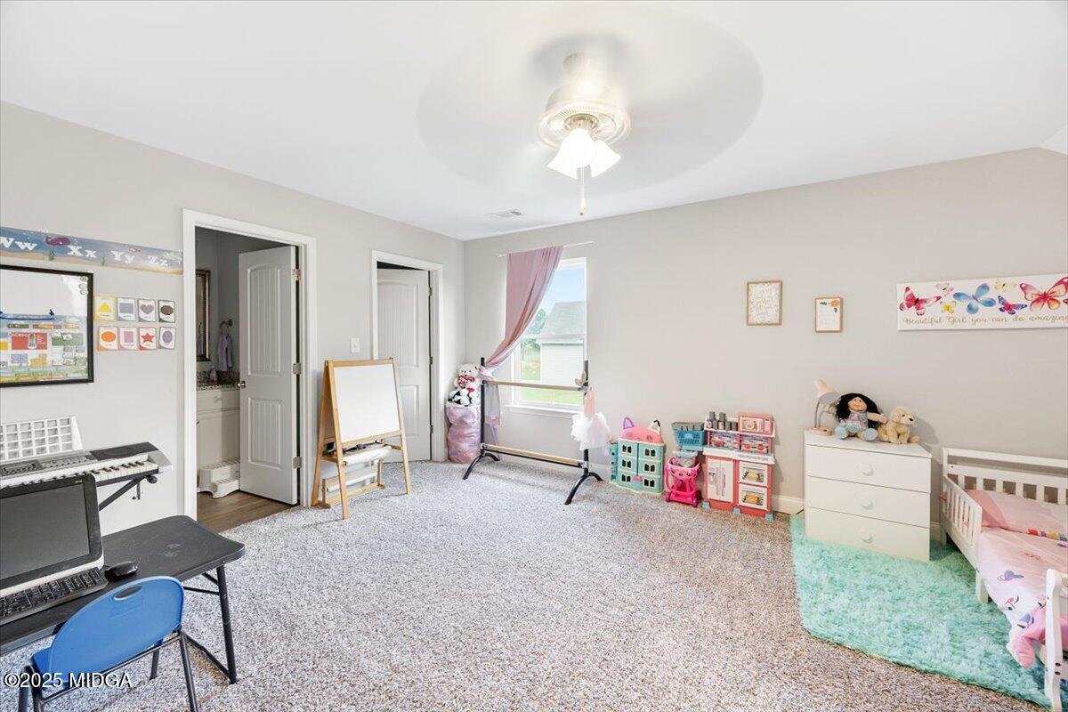 309 Davis Road Gray, GA 31032 - Photo 21 of 48 a living room with furniture and a flat screen tv