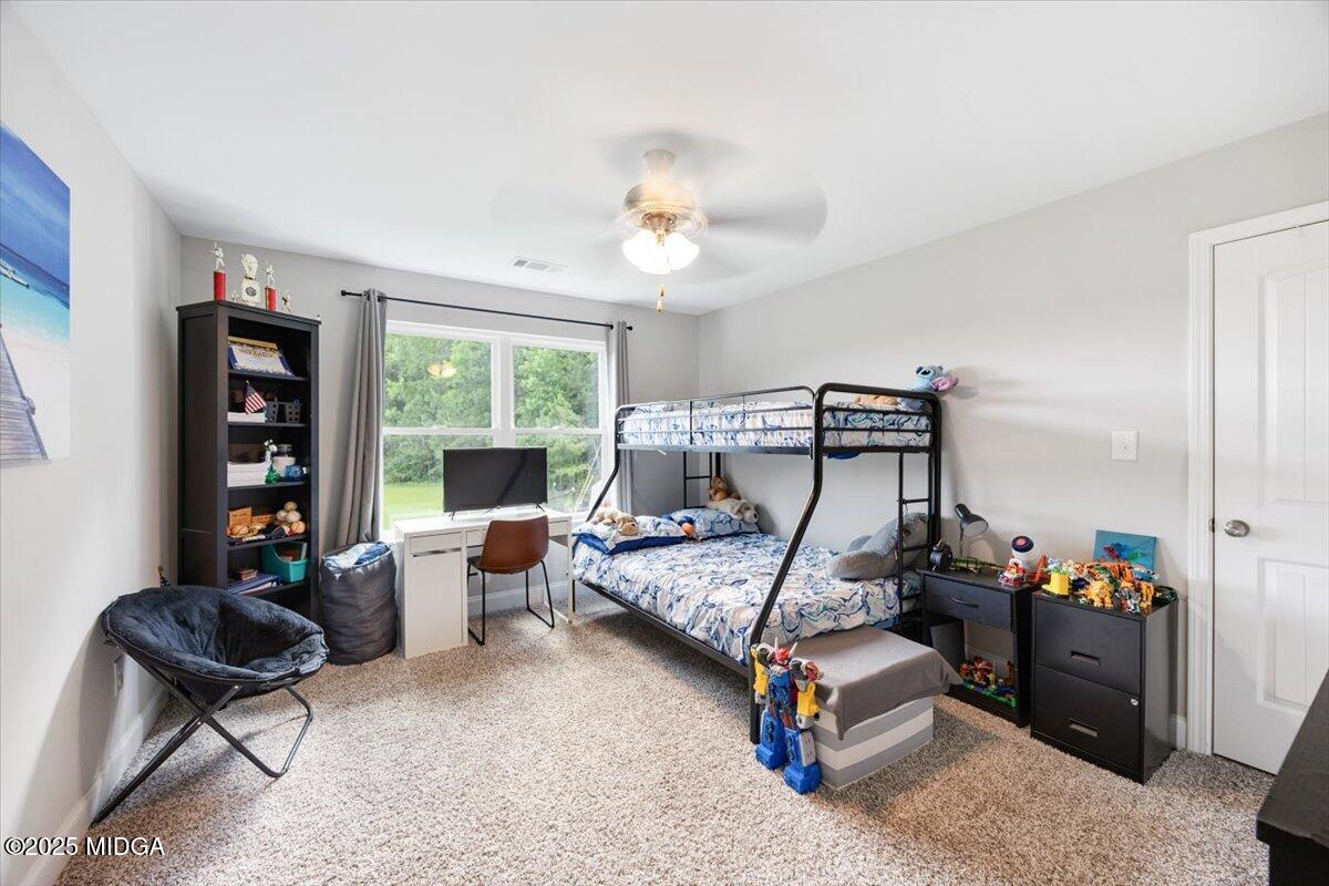 309 Davis Road Gray, GA 31032 - Photo 25 of 48 a bedroom with furniture and windows