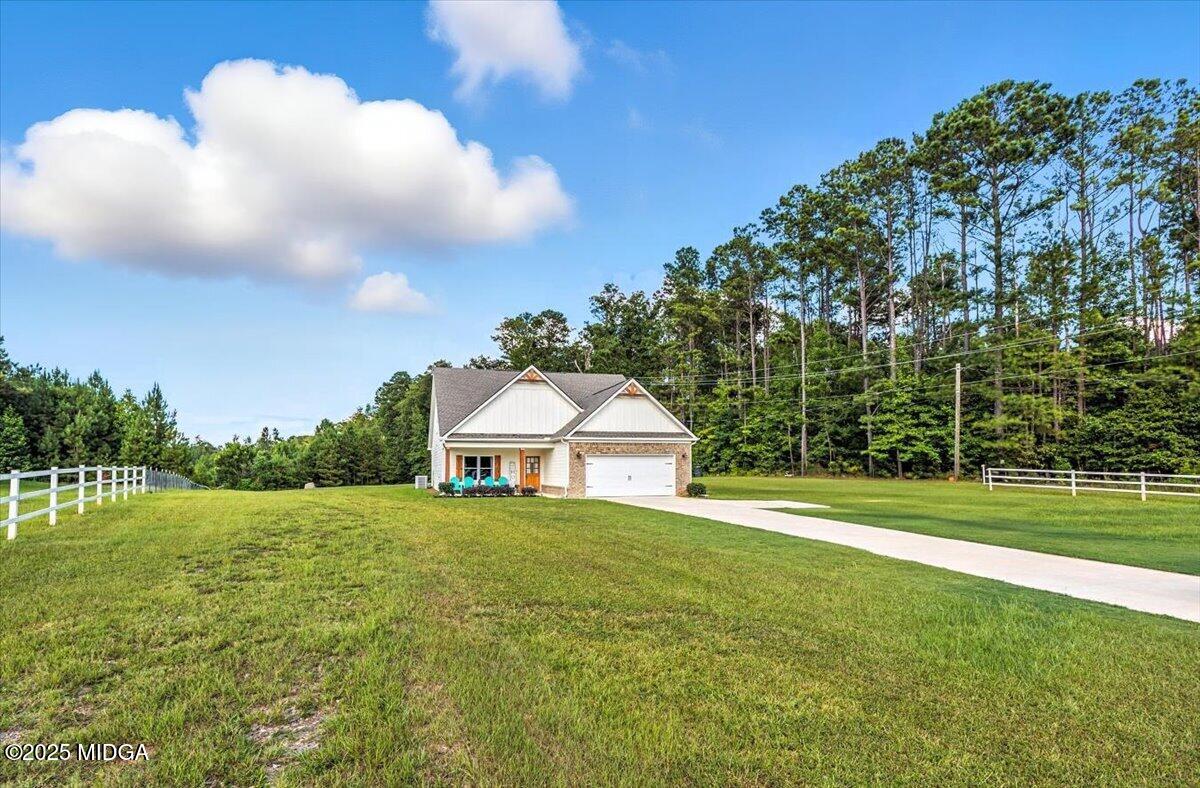 309 Davis Road Gray, GA 31032 - Photo 41 of 48 a view of a big yard with a house in the background