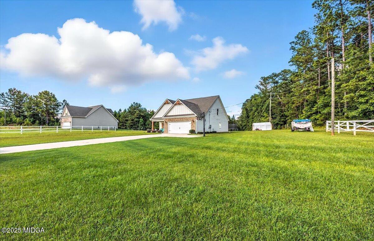 309 Davis Road Gray, GA 31032 - Photo 43 of 48 a view of green field with tree in the background