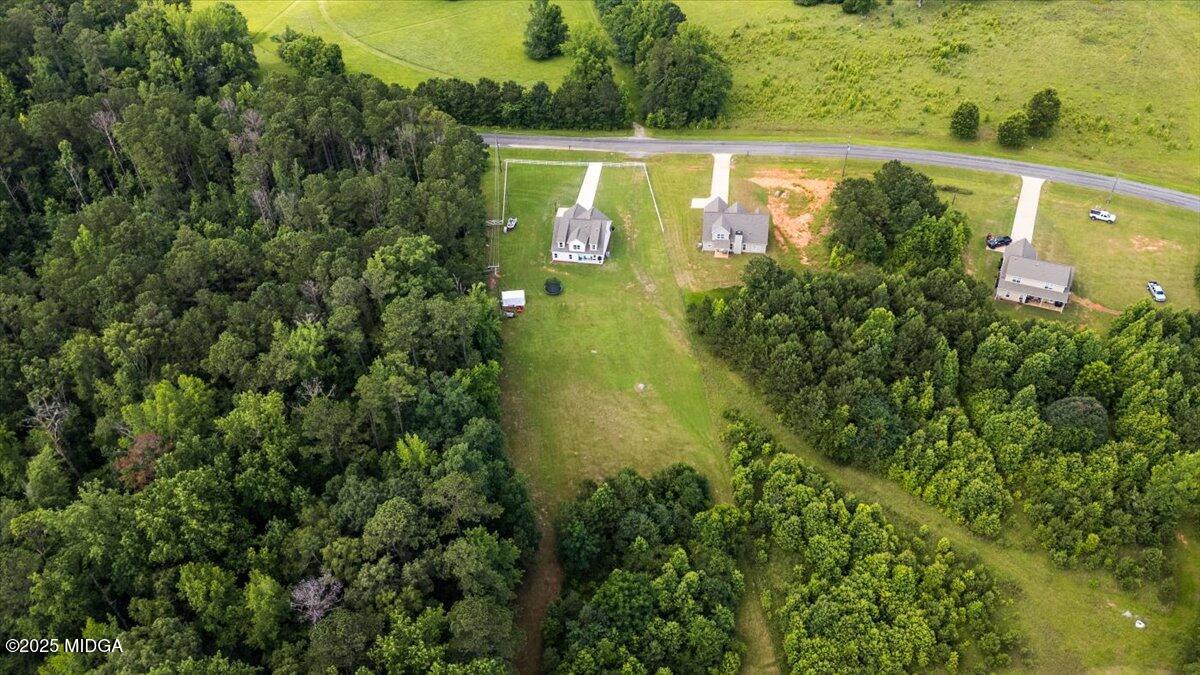 309 Davis Road Gray, GA 31032 - Photo 46 of 48 a view of a lake with a yard