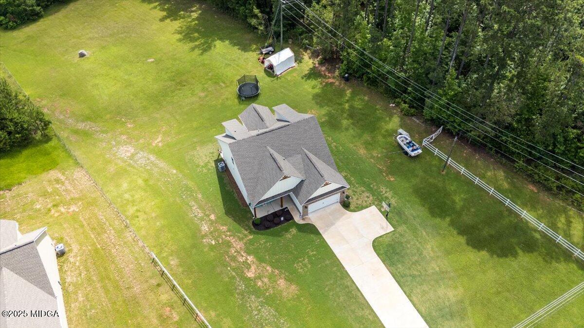 309 Davis Road Gray, GA 31032 - Photo 48 of 48 a view of a swimming pool with a yard