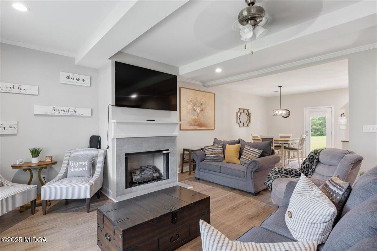 309 Davis Road Gray, GA 31032 - Photo 6 of 48 a living room with furniture a flat screen tv and a fireplace