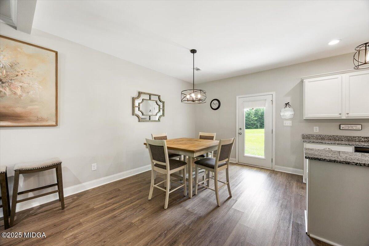309 Davis Road Gray, GA 31032 - Photo 10 of 48 a view of a dining room with furniture window and wooden floor