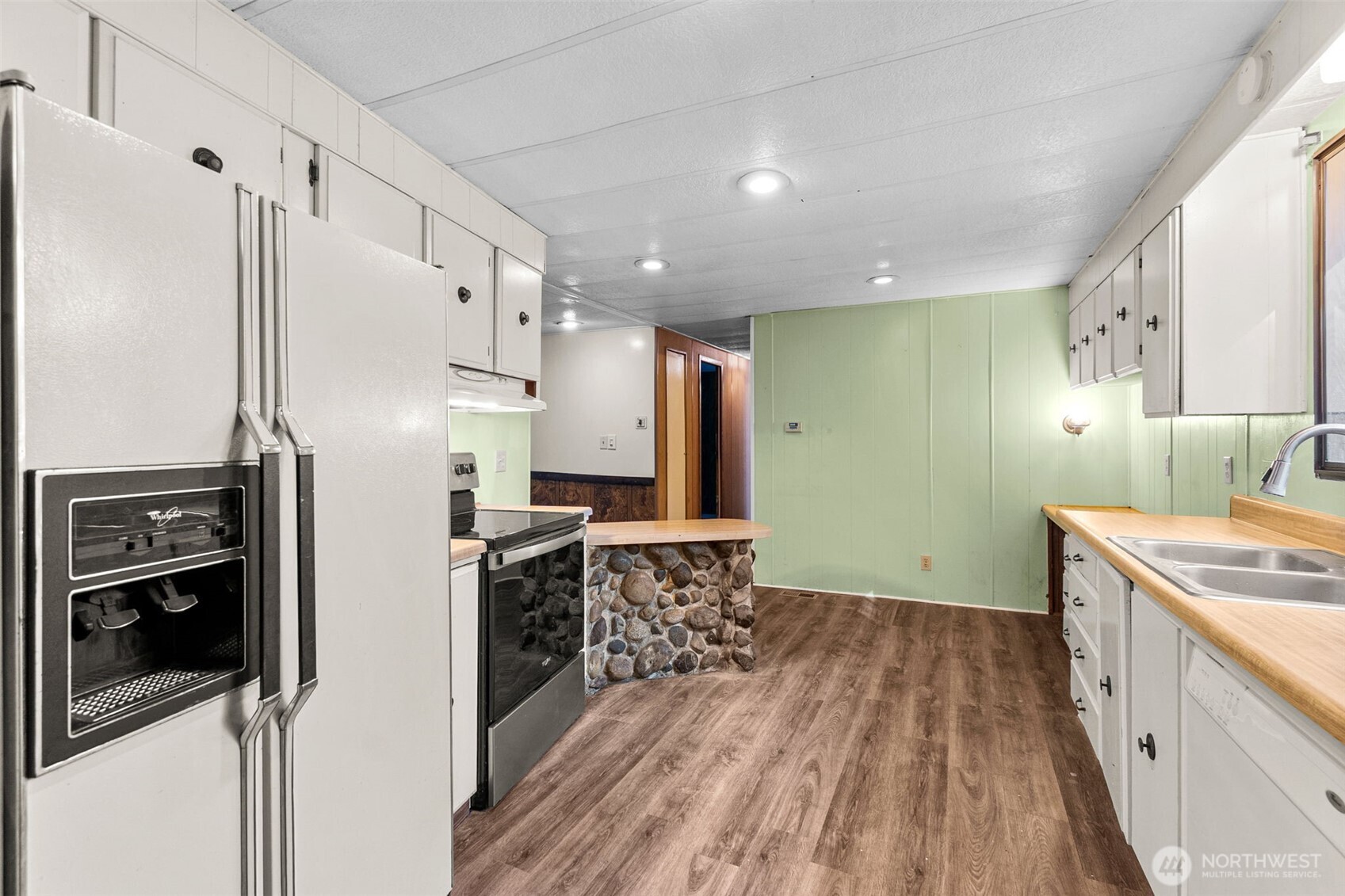 4312 Meridian Road Northeast Lacey, WA 98516 - Photo 11 of 21 a kitchen with a refrigerator and a sink