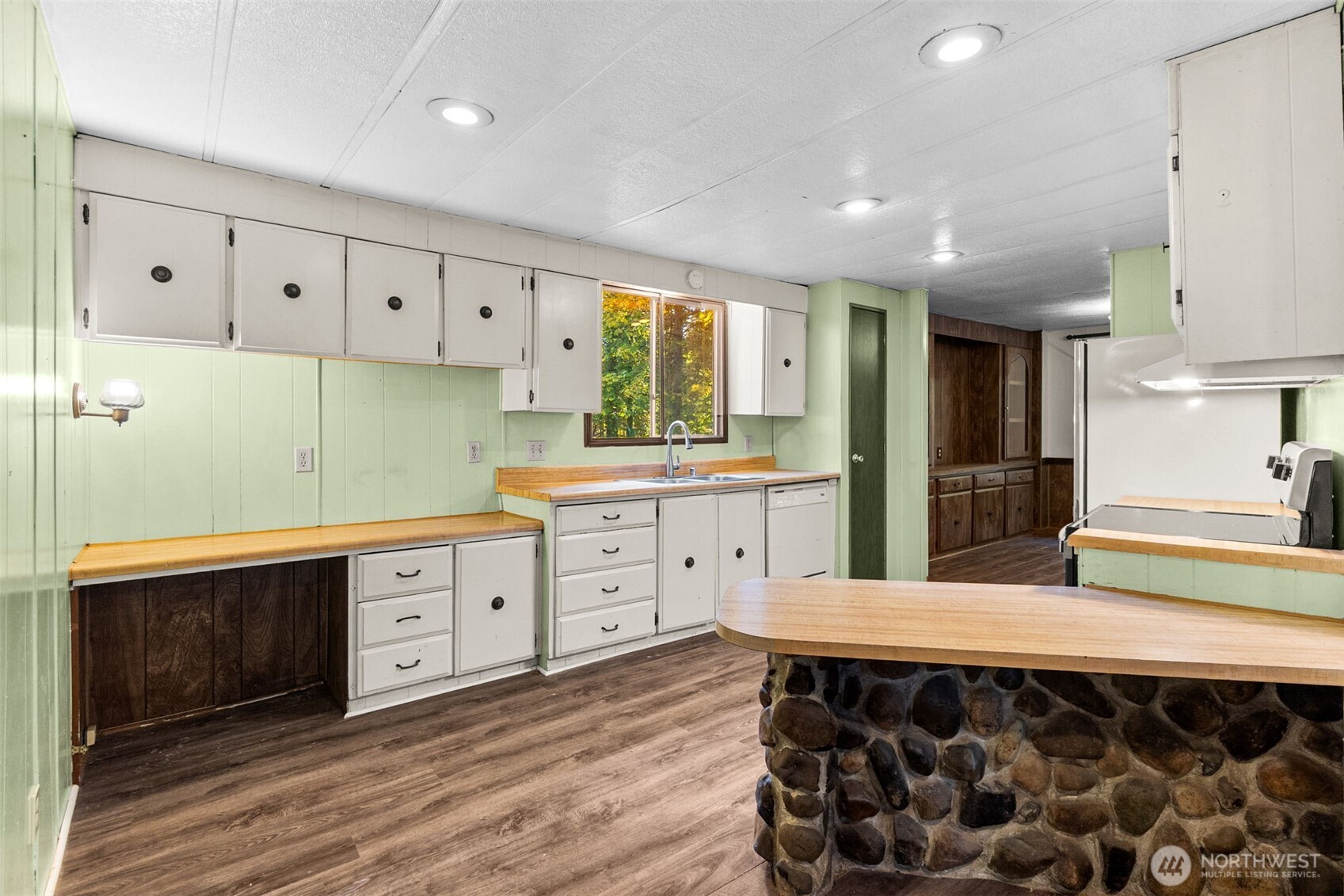 4312 Meridian Road Northeast Lacey, WA 98516 - Photo 12 of 21 a kitchen with a sink appliances and cabinets