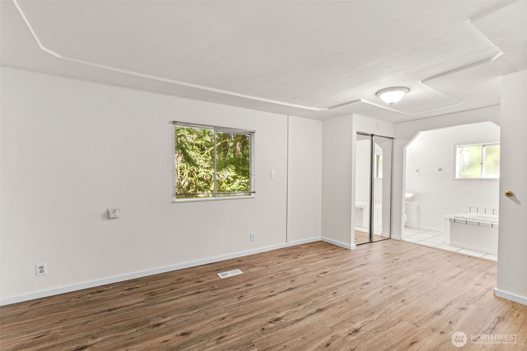 4312 Meridian Road Northeast Lacey, WA 98516 - Photo 14 of 21 wooden floor in an empty room with a window