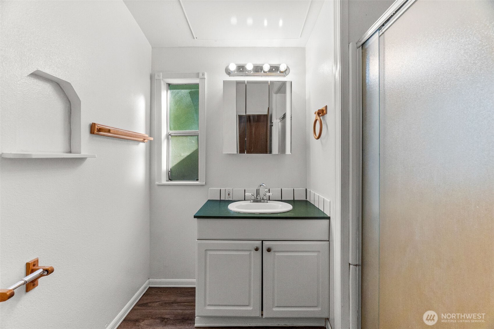 4312 Meridian Road Northeast Lacey, WA 98516 - Photo 15 of 21 a bathroom with a sink vanity and mirror