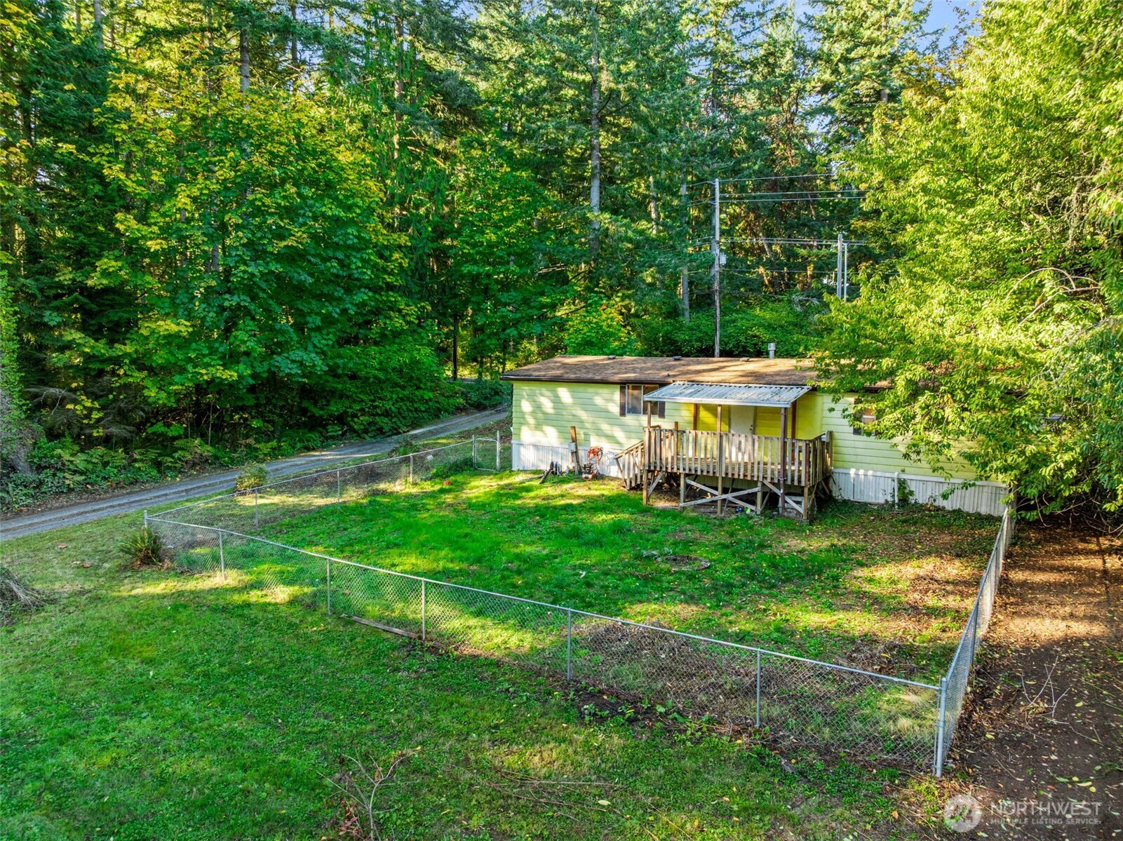 4312 Meridian Road Northeast Lacey, WA 98516 - Photo 6 of 21 a view of a house with a yard deck and sitting area
