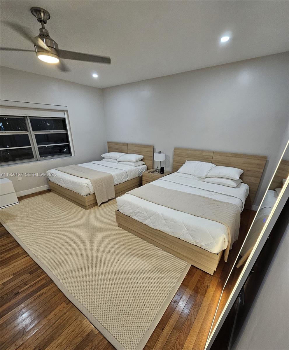 101 Collins Avenue, Unit 3 Miami Beach, FL 33139 - Photo 4 of 4 a bedroom with two beds and a stove