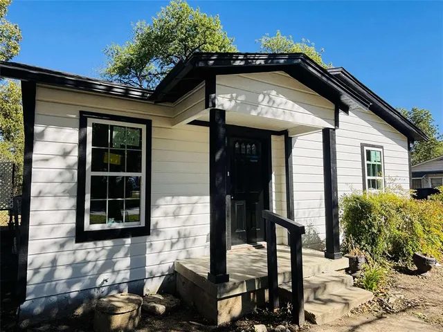 a front view of a house with parking
