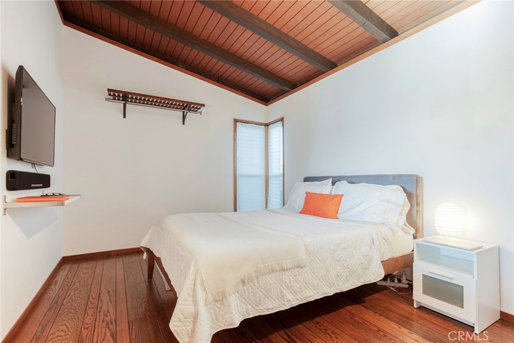 3105 Knob Street Nice, CA 95464 - Photo 19 of 36 a bedroom with a bed and a flat screen tv