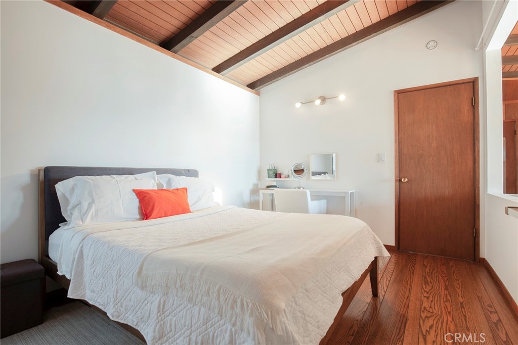 3105 Knob Street Nice, CA 95464 - Photo 20 of 36 a bedroom with a bed and wooden floor