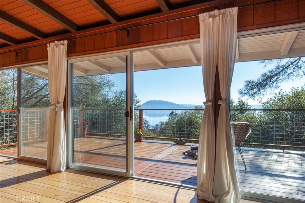 3105 Knob Street Nice, CA 95464 - Photo 2 of 36 a view of a glass door with a floor to ceiling window next to a yard