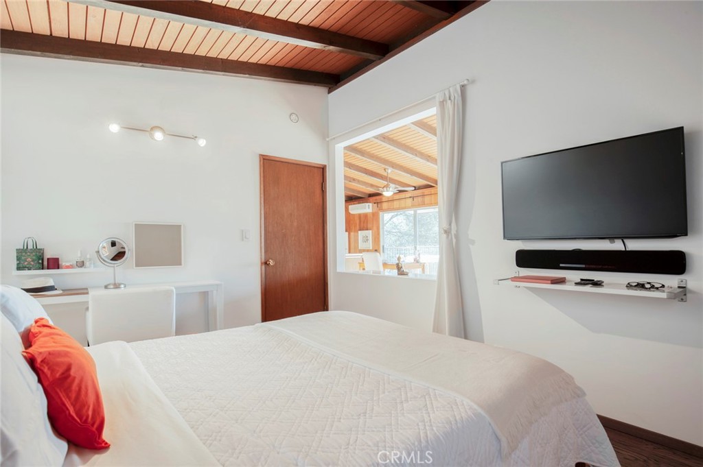 3105 Knob Street Nice, CA 95464 - Photo 21 of 36 a bedroom with a bed and a flat screen tv