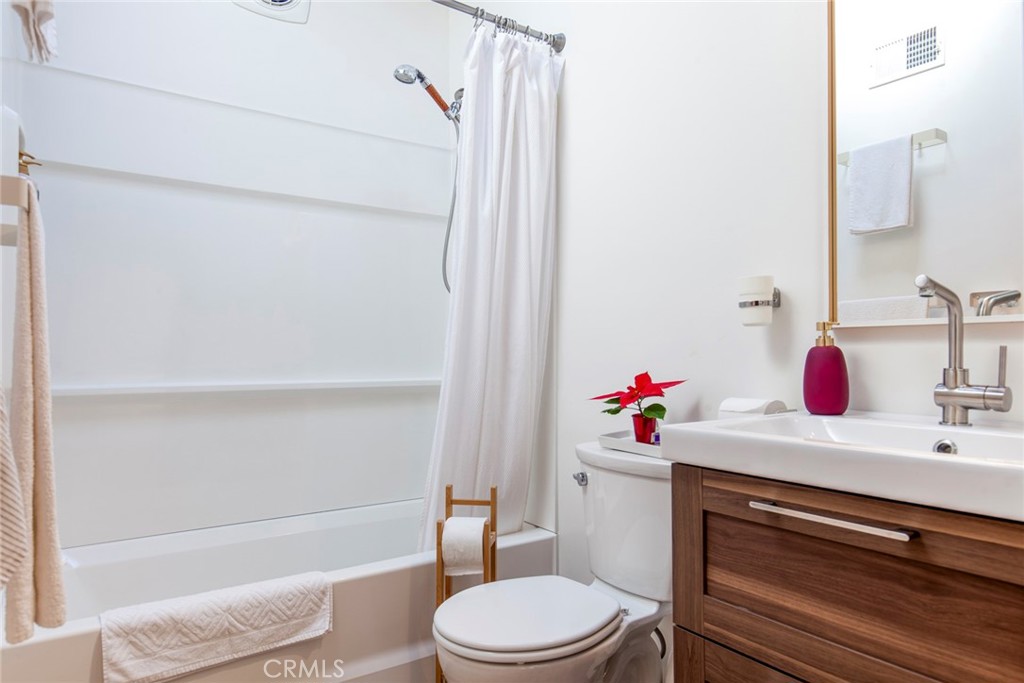 3105 Knob Street Nice, CA 95464 - Photo 22 of 36 a white toilet sitting next to a bathroom sink