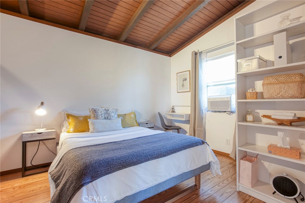 3105 Knob Street Nice, CA 95464 - Photo 23 of 36 a bedroom with a bed a dresser and next to a window