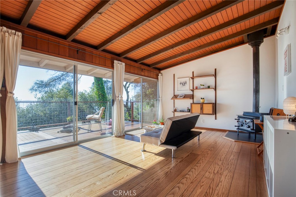 3105 Knob Street Nice, CA 95464 - Photo 3 of 36 a living room with furniture a wooden floor and next to a window