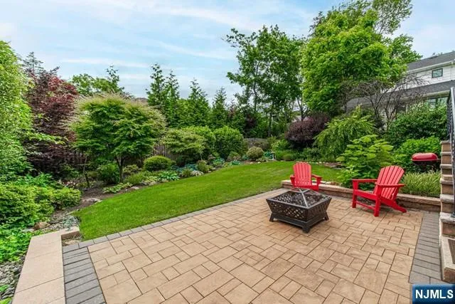 a view of a backyard with sitting area
