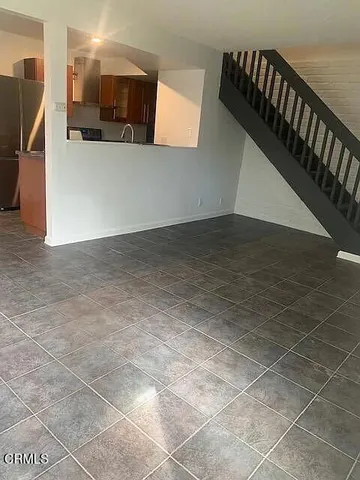 a view of a living room with a rug