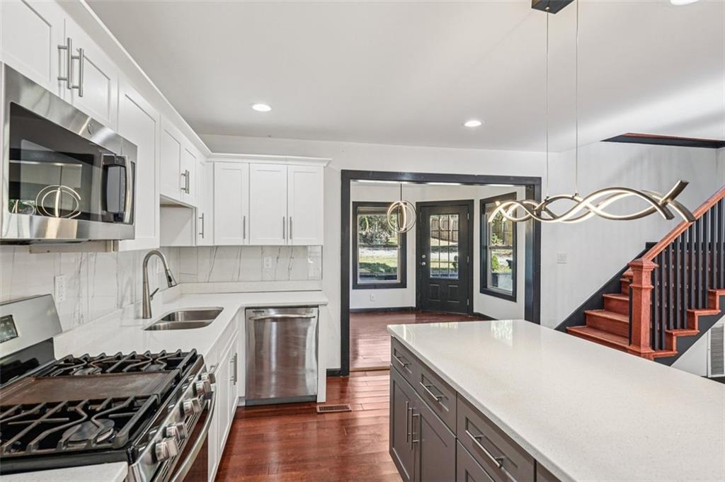 1689 Derry Avenue Southwest Atlanta, GA 30310 - Photo 15 of 51 a kitchen with a stove and a sink