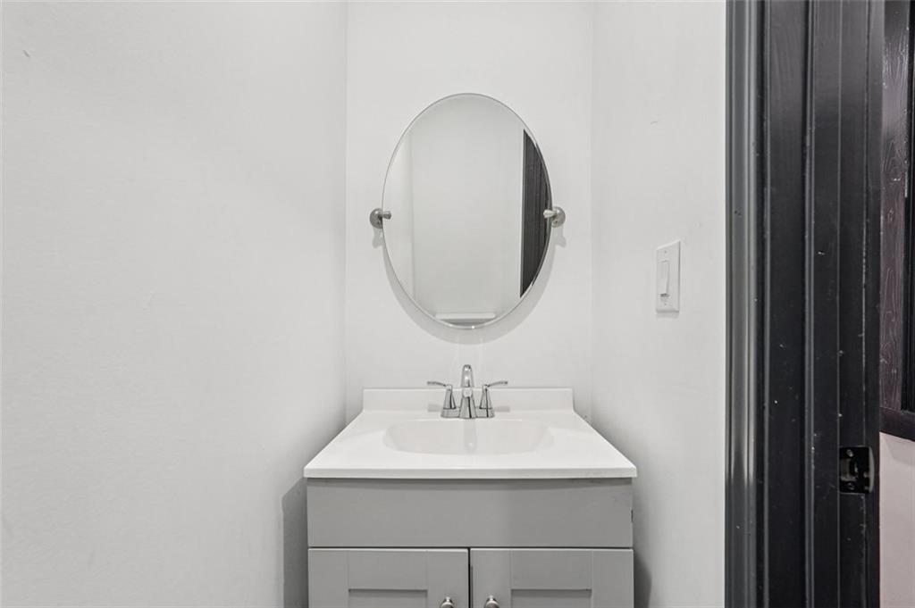 1689 Derry Avenue Southwest Atlanta, GA 30310 - Photo 16 of 51 a bathroom with a sink and a mirror