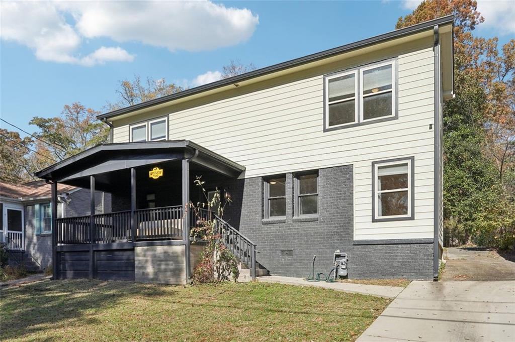1689 Derry Avenue Southwest Atlanta, GA 30310 - Photo 2 of 51 a front view of a house with a yard