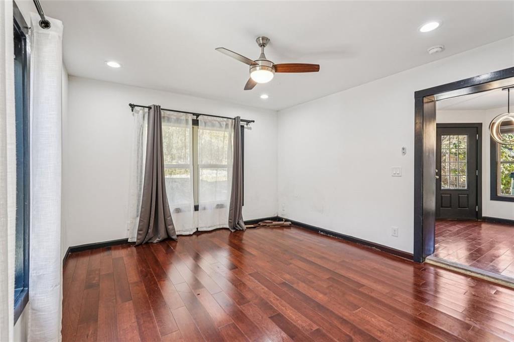 1689 Derry Avenue Southwest Atlanta, GA 30310 - Photo 23 of 51 a view of an empty room with wooden floor and a window