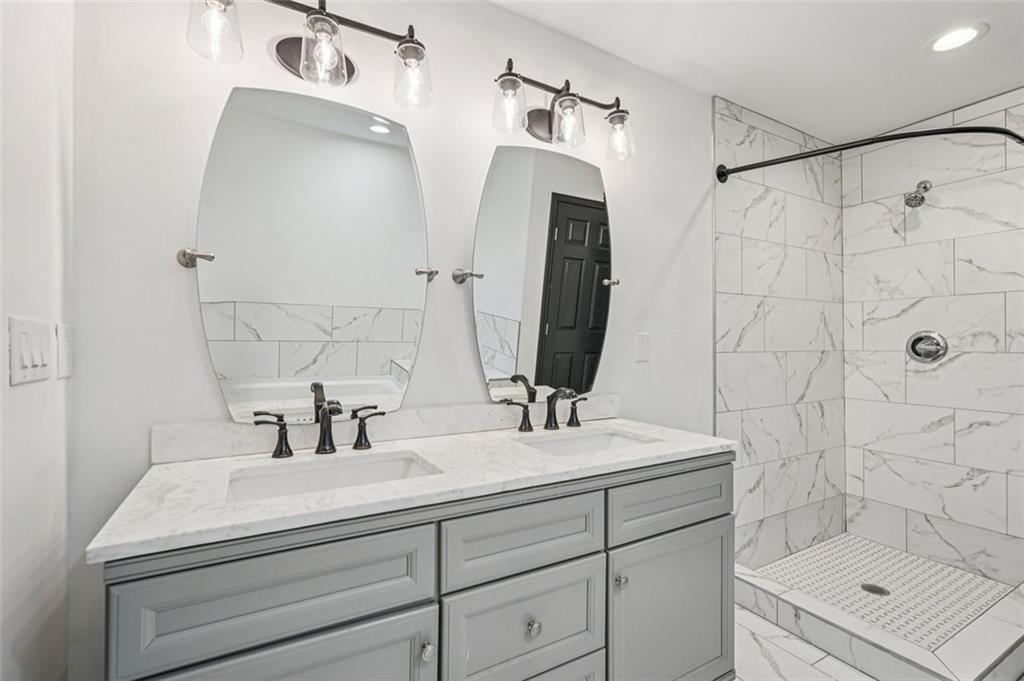 1689 Derry Avenue Southwest Atlanta, GA 30310 - Photo 26 of 51 a bathroom with a sink and a mirror