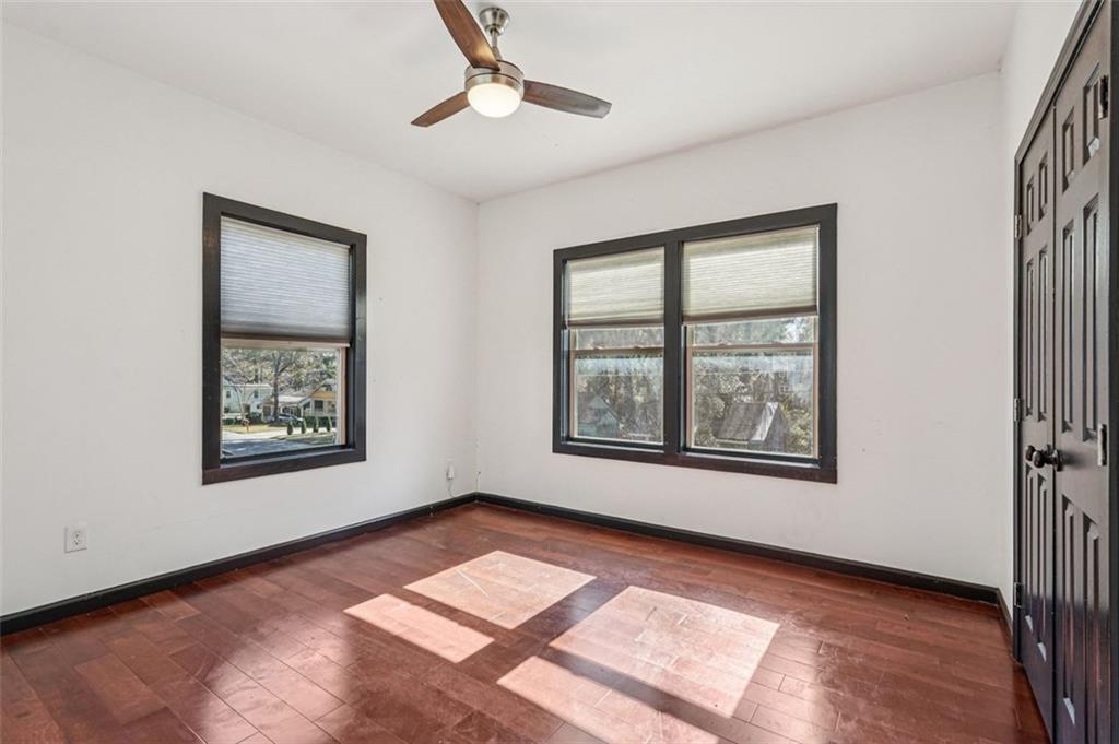 1689 Derry Avenue Southwest Atlanta, GA 30310 - Photo 30 of 51 a view of an empty room with a window and wooden floor