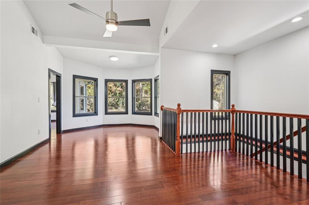 1689 Derry Avenue Southwest Atlanta, GA 30310 - Photo 32 of 51 a view of an empty room with wooden floor and a window