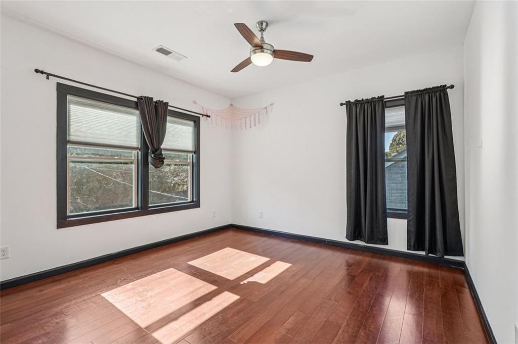 1689 Derry Avenue Southwest Atlanta, GA 30310 - Photo 38 of 51 wooden floor in an empty room with a window