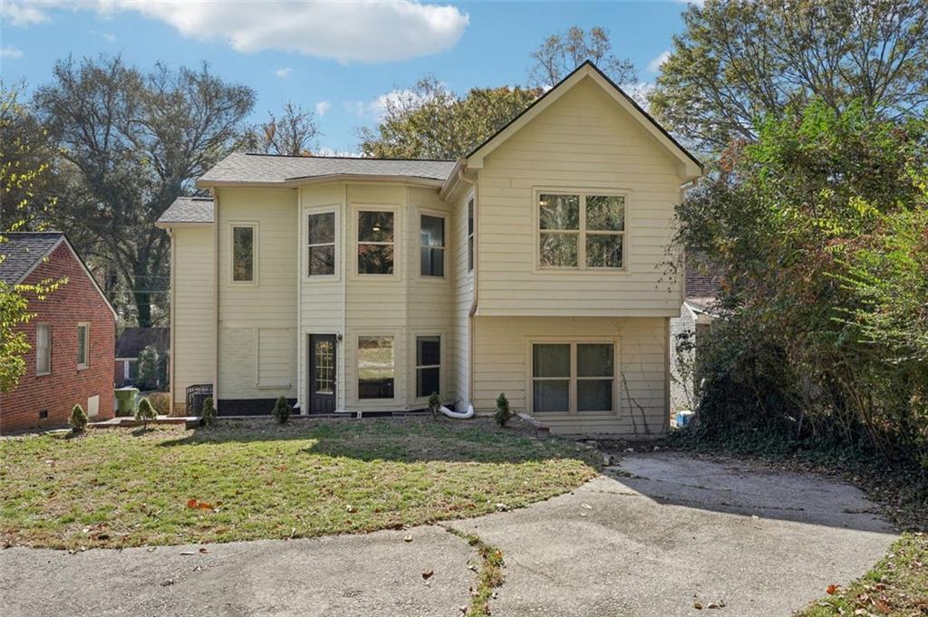 1689 Derry Avenue Southwest Atlanta, GA 30310 - Photo 46 of 51 front view of a house with a yard