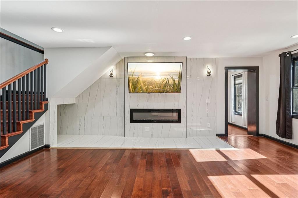 1689 Derry Avenue Southwest Atlanta, GA 30310 - Photo 5 of 51 a view of front door with hallway and wooden floor